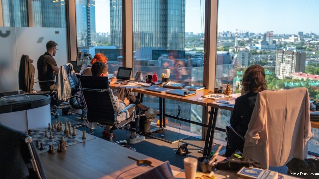 colleagues-working-in-a-beautiful-office-space-looking-out-a-window-1024x576.jpg
